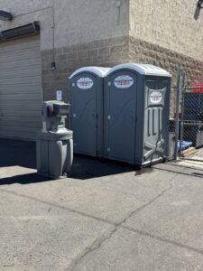 Southwest Sanitation porta potties and a hand wash station at a commercial property