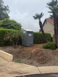 Southwest Sanitation porta potty at the curb in front of a home in Sun Lakes, AZ